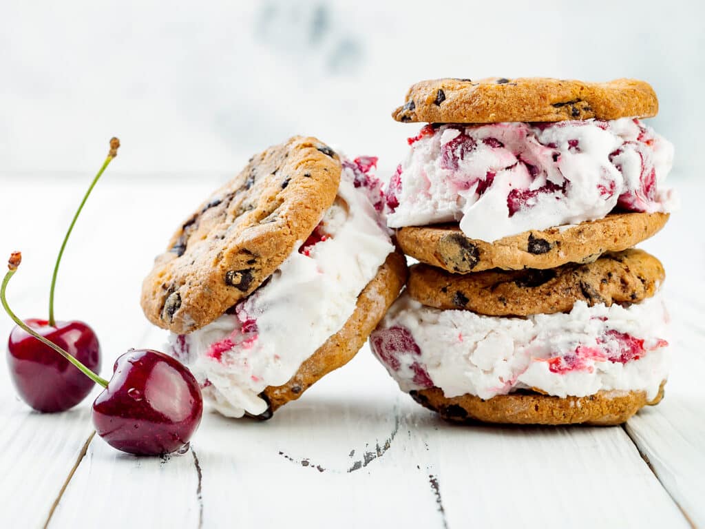 Homemade Black Forest roasted cherry ice cream sandwiches with chocolate chip cookies