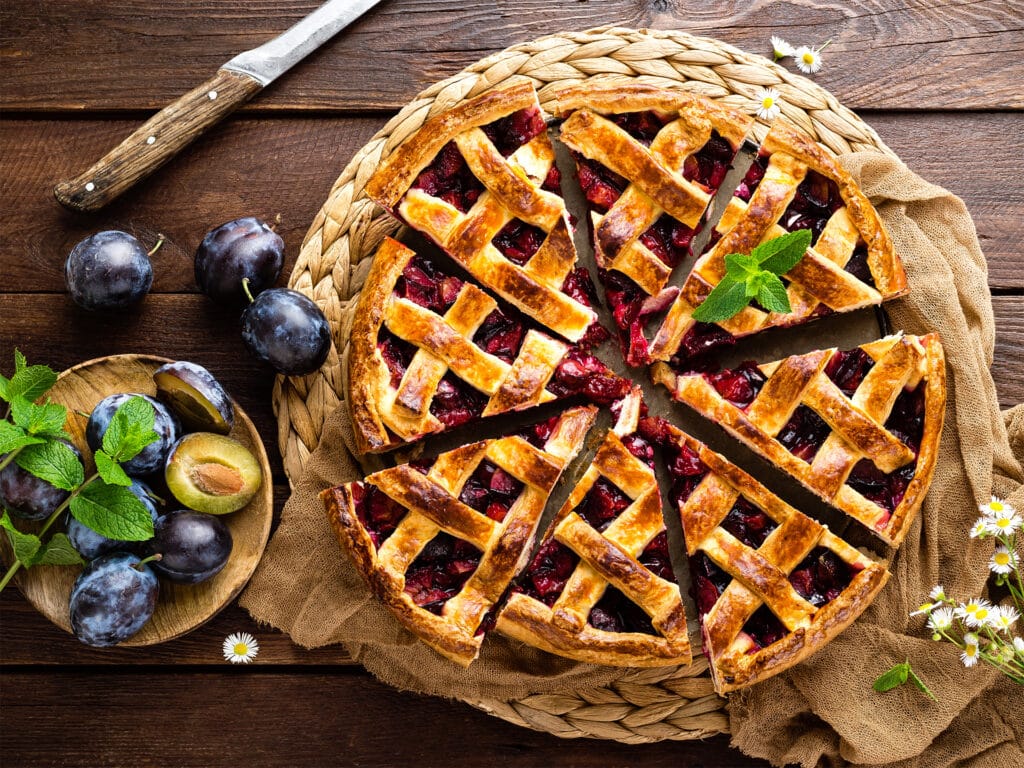 Fruit pie. Sweet pie, tart with fresh plums. Delicious cake with plums