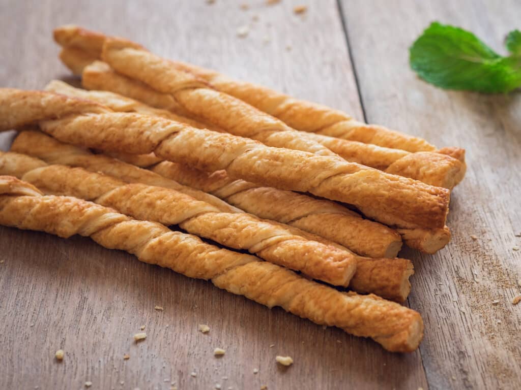 Bread sticks on old wooden table