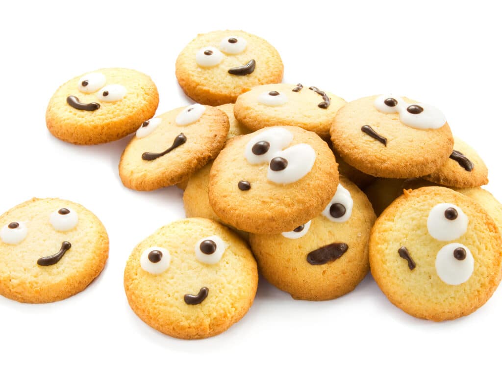 Cookies with faces isolated on white.