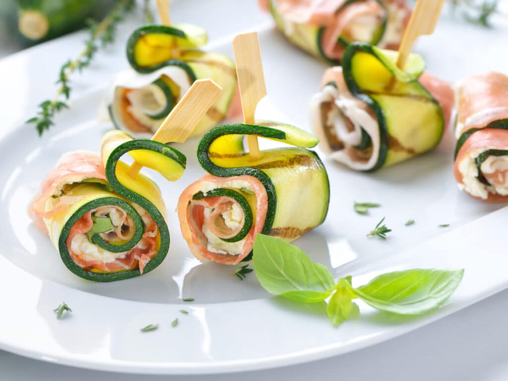 Zucchini appetizer rolls with delicious Italian ham and cream cheese with basil